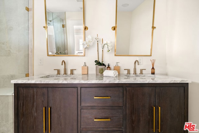 bathroom featuring vanity and a tile shower