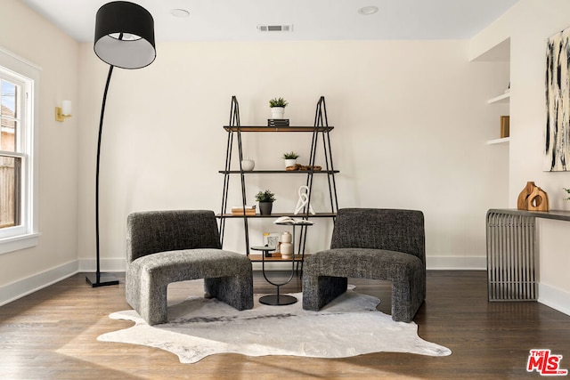 sitting room with hardwood / wood-style floors