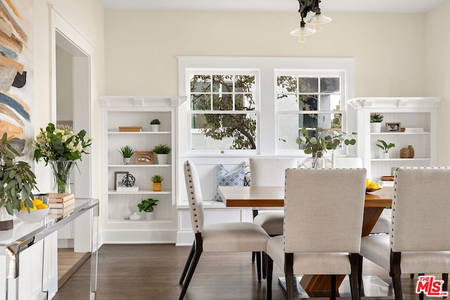 dining area with dark hardwood / wood-style flooring