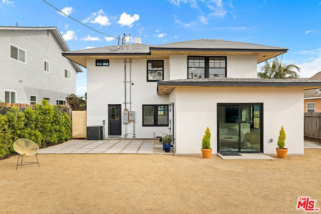 rear view of property with a patio and central air condition unit