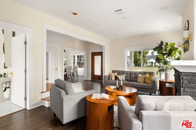 living room with dark hardwood / wood-style flooring