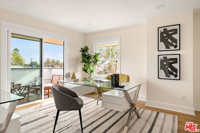 office space with light hardwood / wood-style flooring