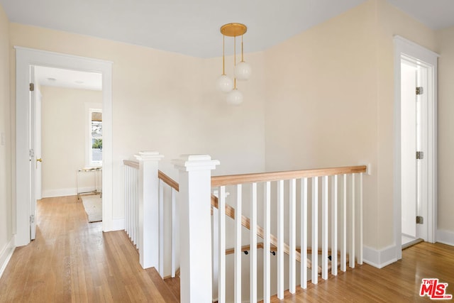 corridor with light hardwood / wood-style flooring