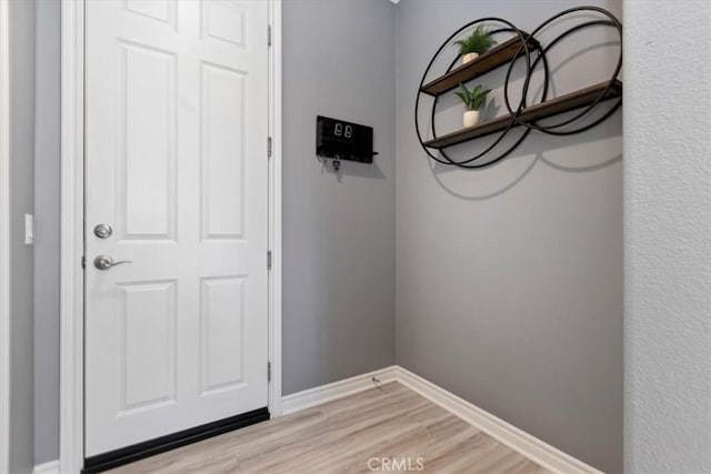 doorway with light hardwood / wood-style flooring