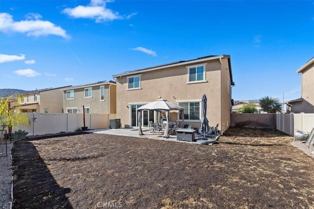 rear view of house with a patio