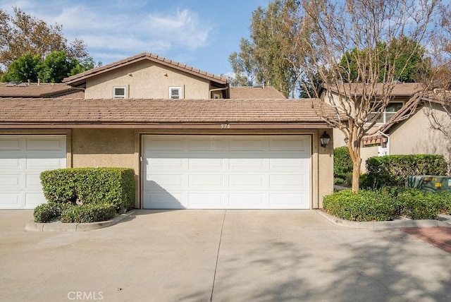 exterior space with concrete driveway