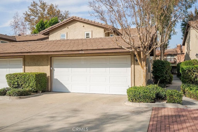 garage with concrete driveway