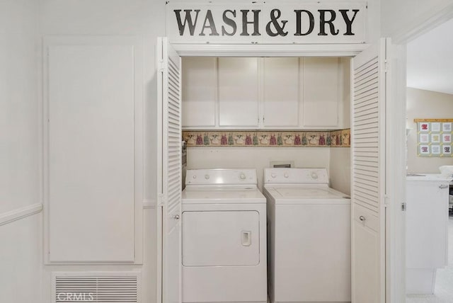 clothes washing area featuring laundry area, washing machine and dryer, and visible vents