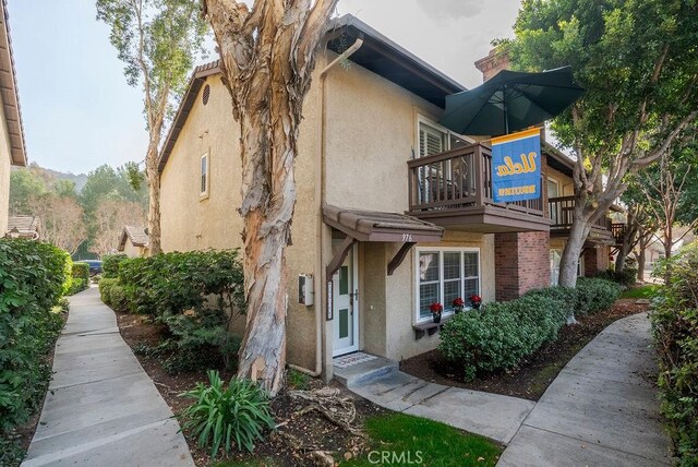 view of property exterior with a balcony