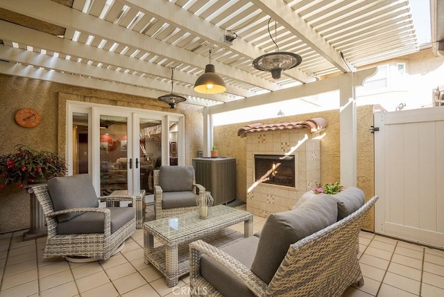 view of patio featuring fence, an outdoor living space, a pergola, and french doors