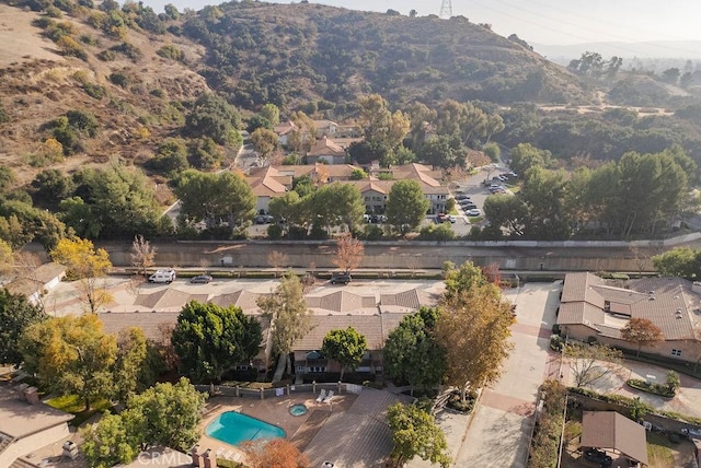 drone / aerial view featuring a residential view and a mountain view