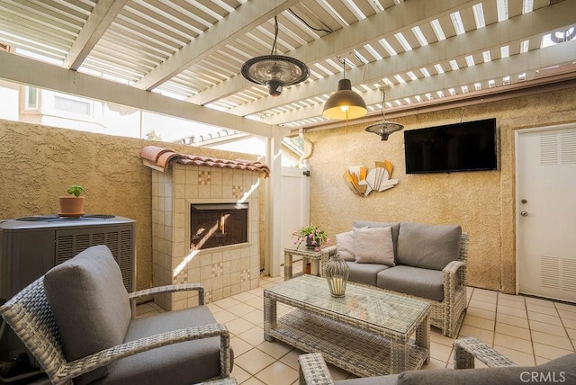 view of patio / terrace featuring an outdoor living space with a fireplace, fence, and a pergola