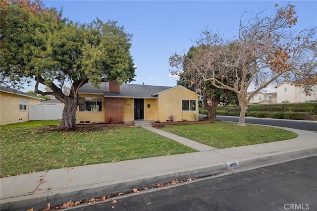 view of front of property with a front lawn