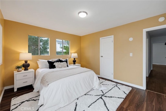 bedroom featuring dark hardwood / wood-style floors