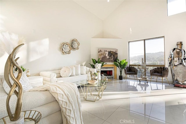 tiled living room featuring high vaulted ceiling