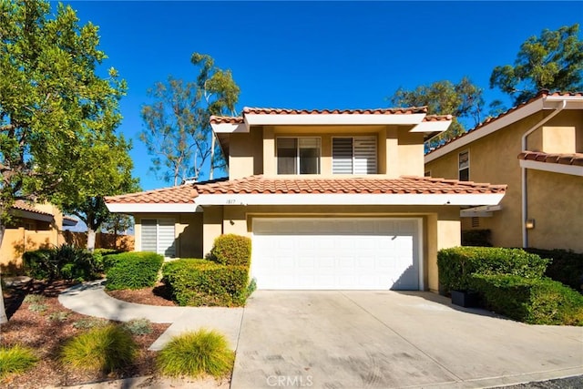 mediterranean / spanish-style home featuring a garage