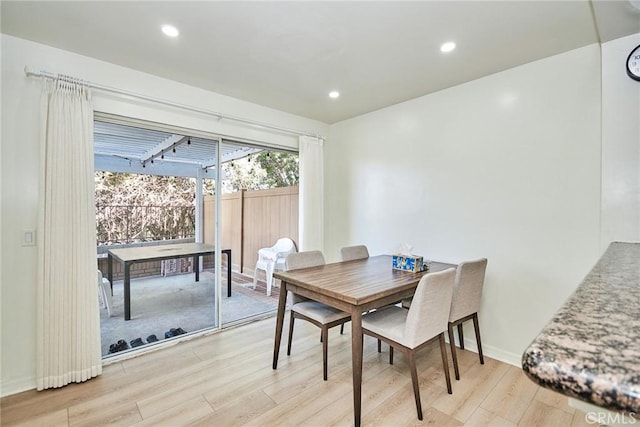 dining space featuring light hardwood / wood-style flooring