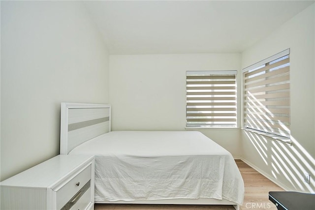 bedroom with light hardwood / wood-style floors