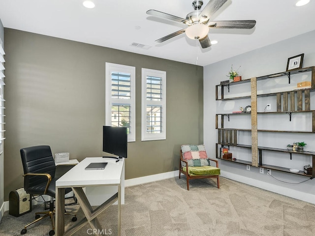 office area featuring ceiling fan and light carpet