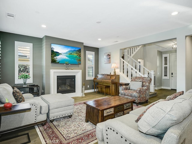 living room with hardwood / wood-style floors and a wealth of natural light