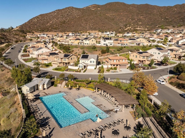 birds eye view of property with a mountain view