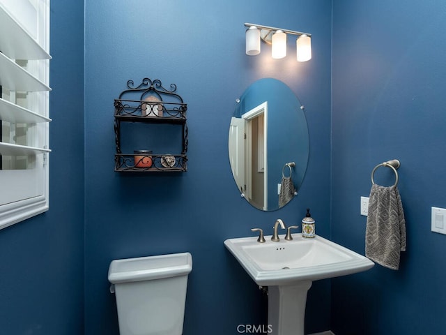 bathroom with toilet and sink