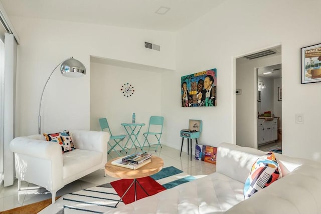 living room featuring light tile patterned floors and lofted ceiling