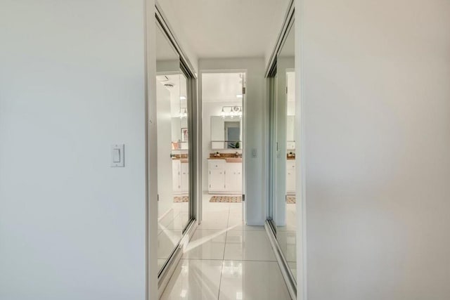 corridor with light tile patterned floors