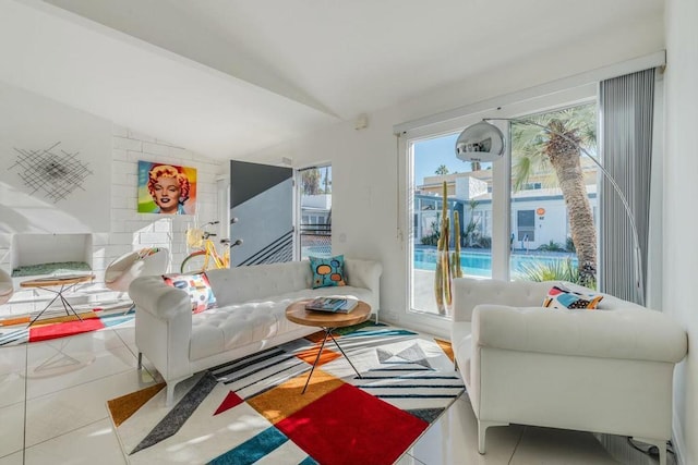 tiled living room featuring lofted ceiling