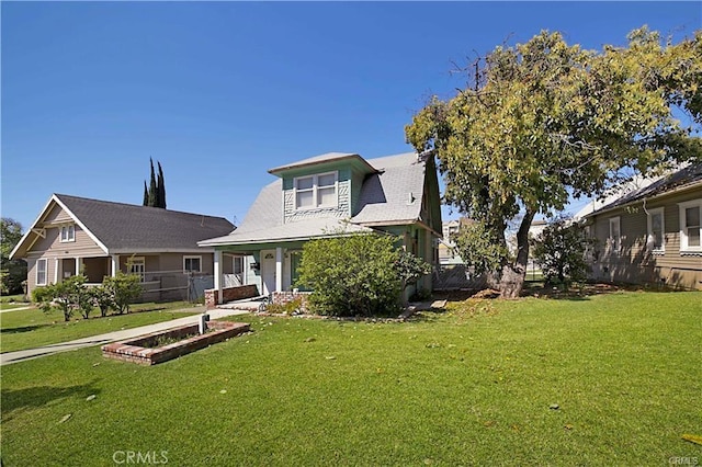 rear view of house with a yard