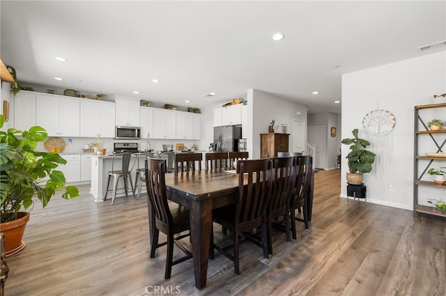 dining room featuring wood-type flooring