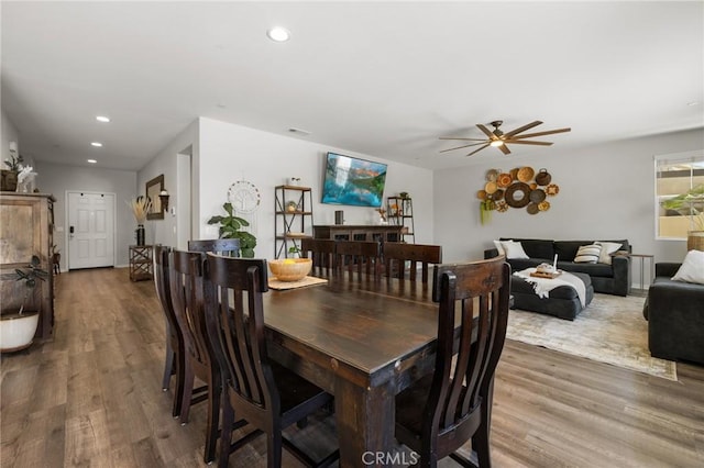 dining area featuring hardwood / wood-style floors and ceiling fan