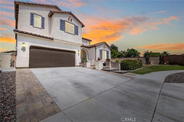 mediterranean / spanish-style house featuring a garage