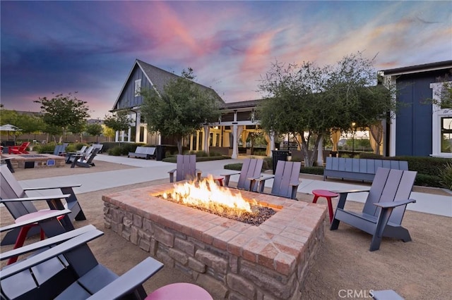 patio terrace at dusk with an outdoor fire pit