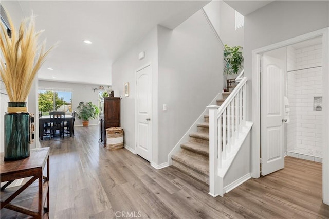 staircase featuring hardwood / wood-style flooring