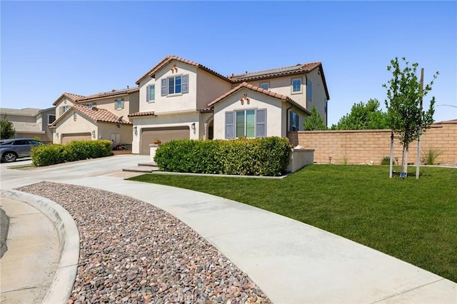 view of front facade with a garage and a front yard