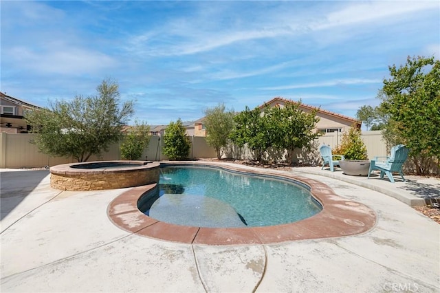 view of pool with an in ground hot tub and a patio