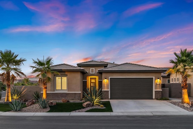 prairie-style house featuring a garage