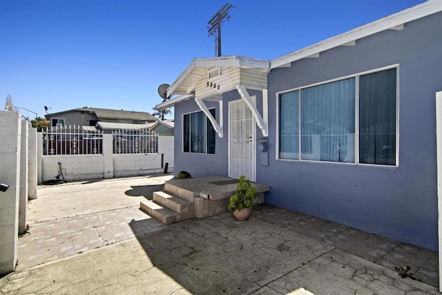 back of house with a patio