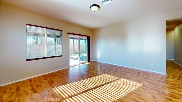 empty room featuring wood-type flooring