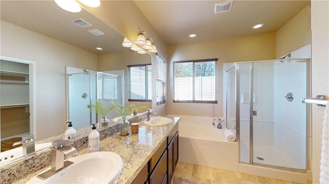 bathroom with shower with separate bathtub and vanity