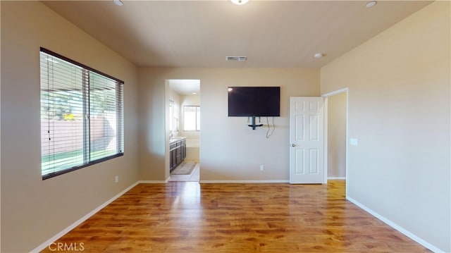 spare room featuring light wood-type flooring