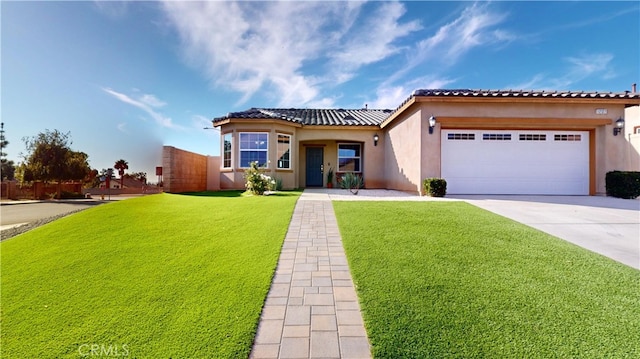 mediterranean / spanish-style house with a front lawn and a garage