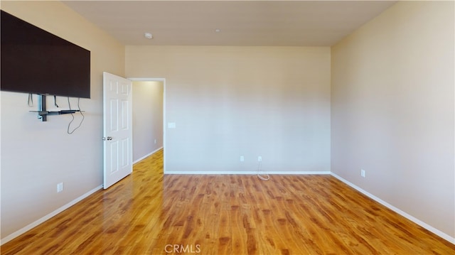 spare room with light wood-type flooring