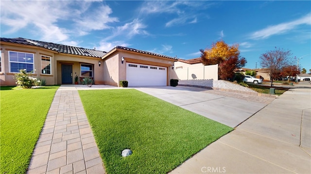 view of front facade featuring a front lawn and a garage