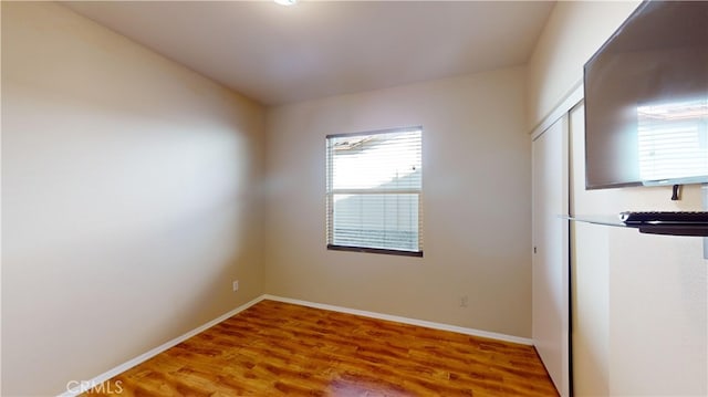 empty room featuring hardwood / wood-style floors