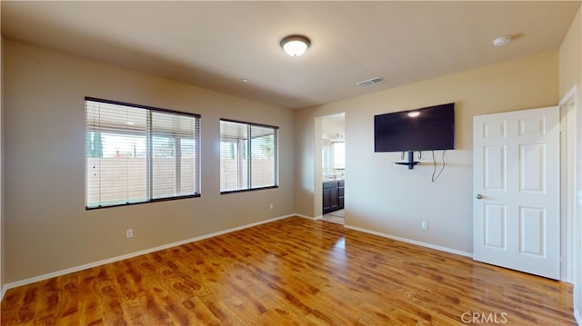 spare room featuring hardwood / wood-style floors