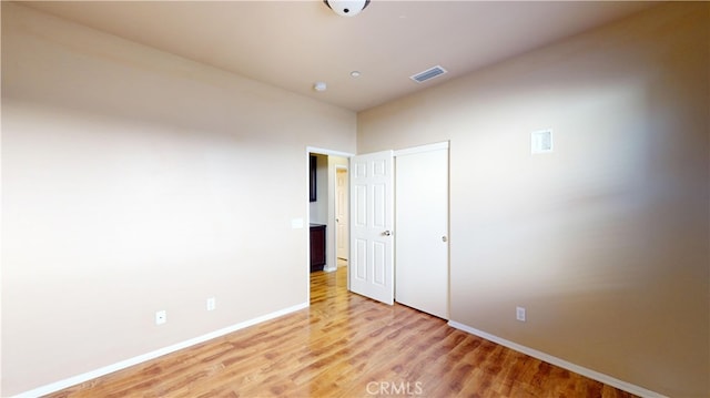 unfurnished bedroom featuring hardwood / wood-style floors