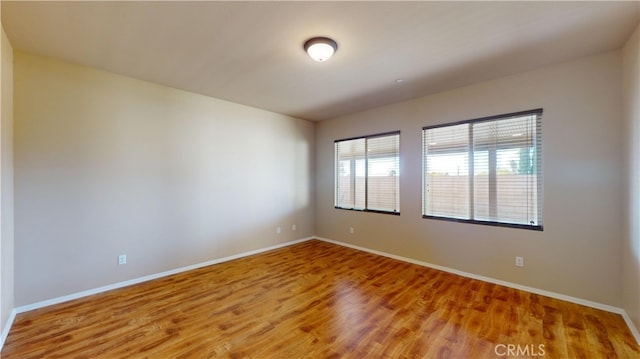 empty room with wood-type flooring