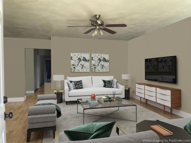 living room featuring ceiling fan, light hardwood / wood-style floors, and a textured ceiling